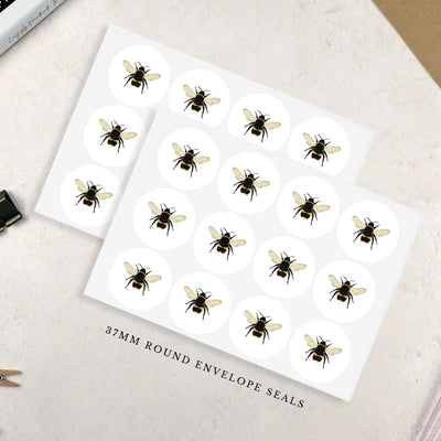 Sheet of bee-themed envelope seals on a white background