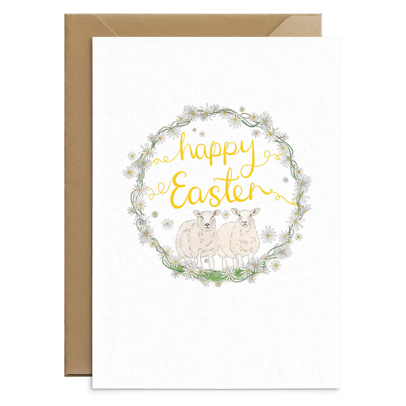 A cute easter greetings card featuring two sheep drawn inside a wreath of daisies and completed by hand scripted yellow text that reads 'happy easter'. On a brown recycled envelopes. Greetings cards by Poppins and co.