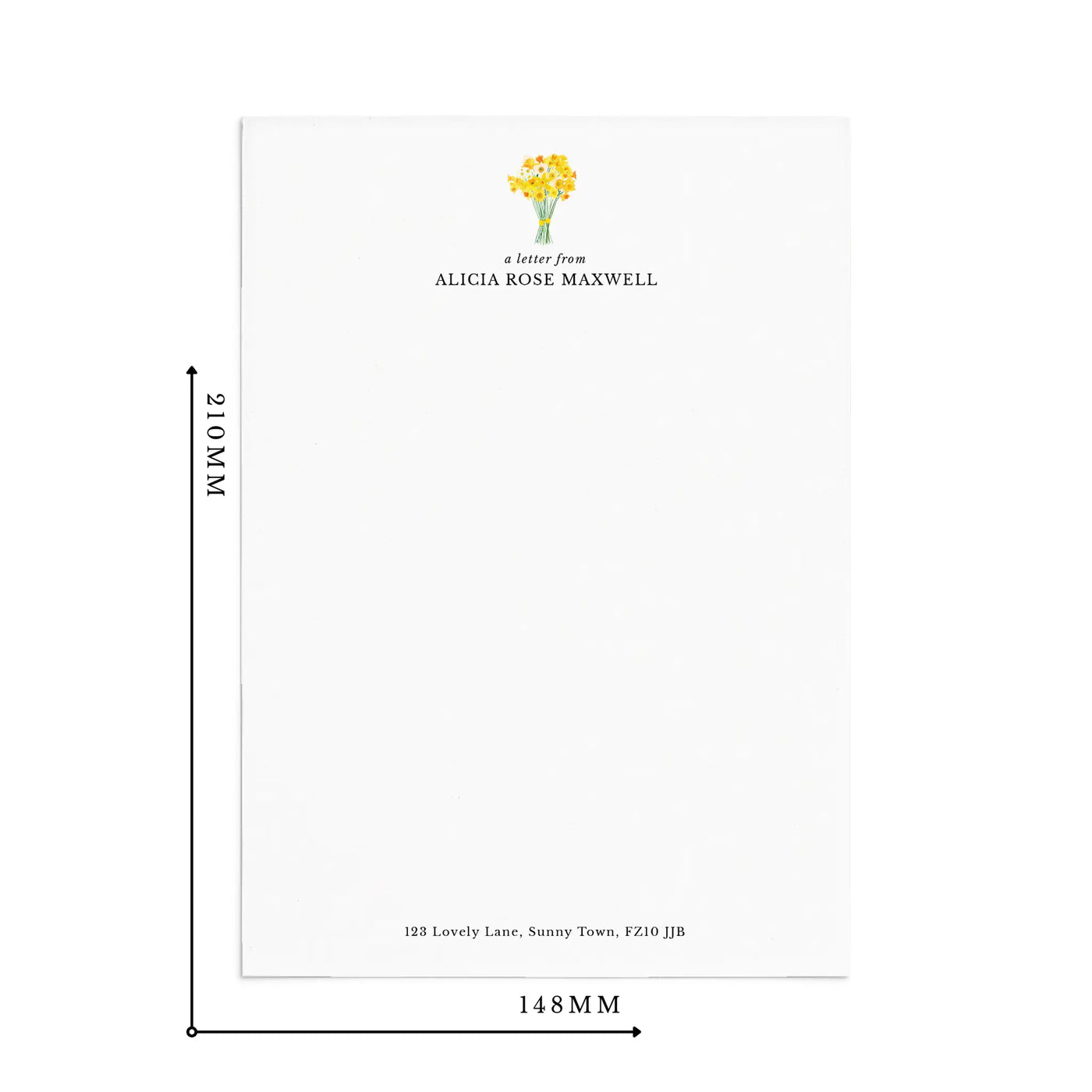 A single sheet of personalised letter writing paper by Poppins and co on a white background with dimensions displayed as 210mm by 148mm. The writing paper is white and has a small bunch of yellow daffodils illustrated at the top of the page. Italic script reads 'a letter from' with the name 'Alicia Rose Maxwell' typed in all caps font below it. At the bottom of the page is a typed address.