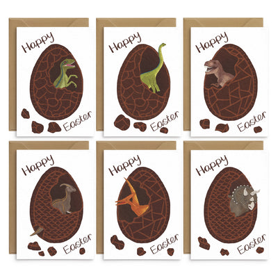 An unusual set of easter greetings cards for kids featuring 6 different dinosaurs hatching from inside chocolate easter eggs. Illustrations of a velociraptor, diplodocus, T rex, parasaurolophus, pterodactyl and triceratops. Brown text reads 'happy easter' on each card. A set of 6 cards on white card with recycled envelopes. Easter cards by Poppins and co.