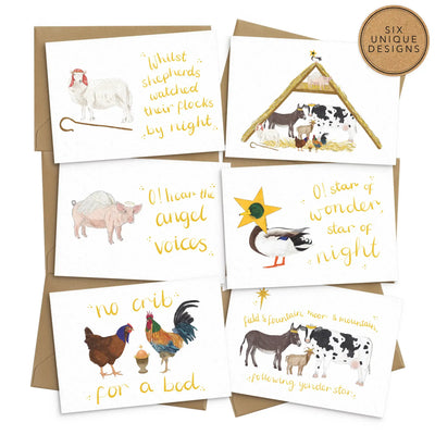 A set of 6 whimsically illustrated holiday cards featuring a variety of nativity themed farm animal illustrations, including chickens, a duck, a pig, a donkey, a cow and a goat in comical scenes and scenarios.