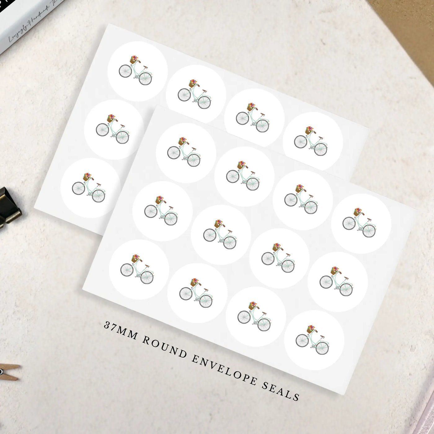 Sheet of bicycle-themed envelope seals on a white background - 37mm round
