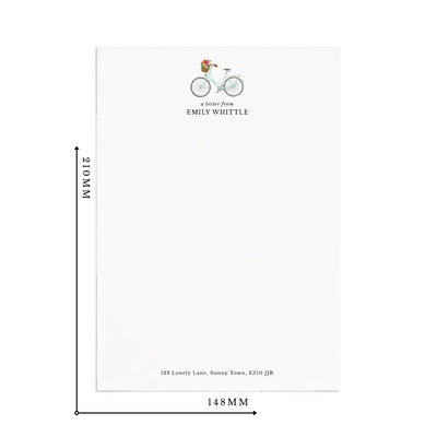 Single sheet of personalised bicycle writing paper on white background with measurements reading 210mm by 148mm.