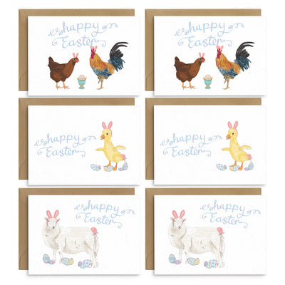Pack of 6 Easter Greetings Cards with 6 mixed designs. Including a sheep, a duckling and a hen and cockerel with an egg. All are dressed as the Easter Bunny with pink bunny ears and tails and an assortment of pastel patterns easter eggs are scattered around. Blue scripted text reads 'happy easter'. Handmade greetings cards by Poppins and Co