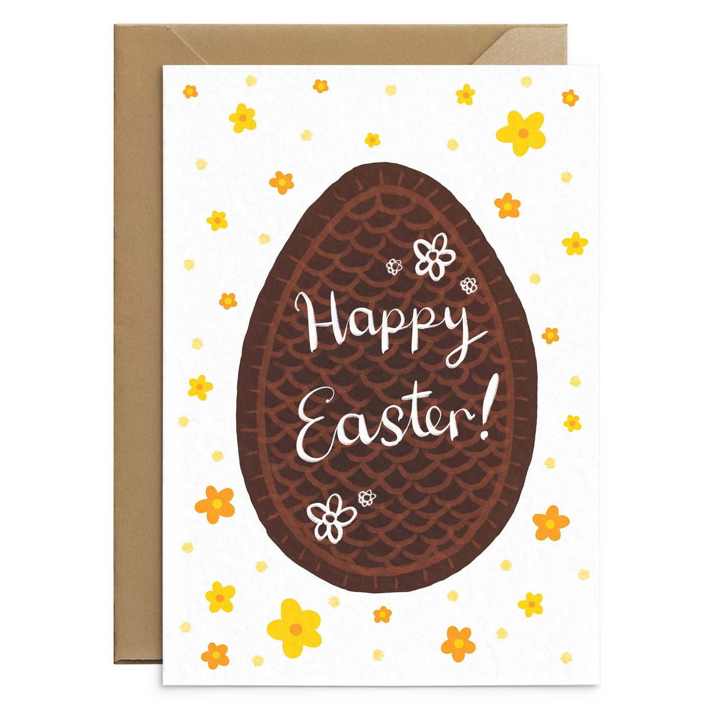 A classic easter greetings card featuring an illustration of a chocolate egg and yellow daisies. Completed by white hand scripted text on the egg illustration that reads 'happy easter'. A white greetings cards laid out on top of a brown recycled envelope. Easter greetings card by Poppins and co.