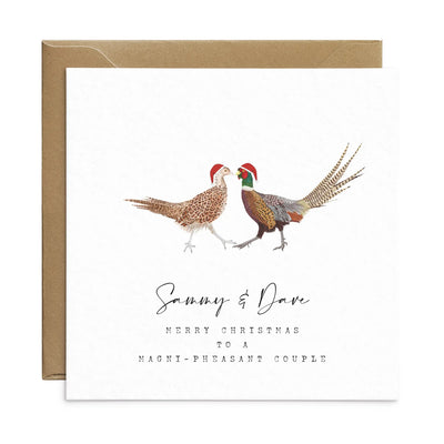 A square christmas card for a magnificent couple featuring unique watercolour illustrations of a pair of pheasants in christmas hats. Beneath the birds personalised text reads 'Sammy and Dave- merry Christmas to a magni-pheasant couple'