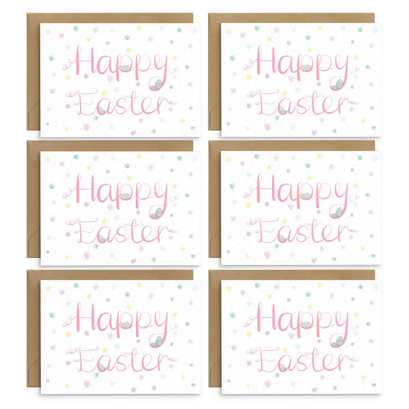 A pack of easter greetings cards with pink writing and pastel coloured easter egg illustrations. 6 white cards are laid onto of brown recycled envelopes. Easter Greetings cards by Poppins and Co.