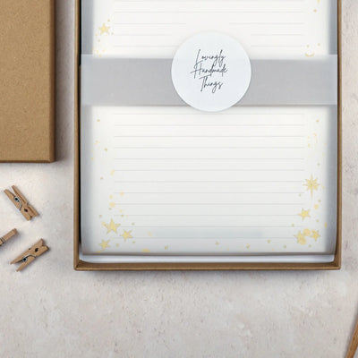 Packaged writing paper set in a brown kraft stationery gift box. The paper is wrapped with vellum and sealed with a white sticker which reads 'Lovingly Handmade Things'.