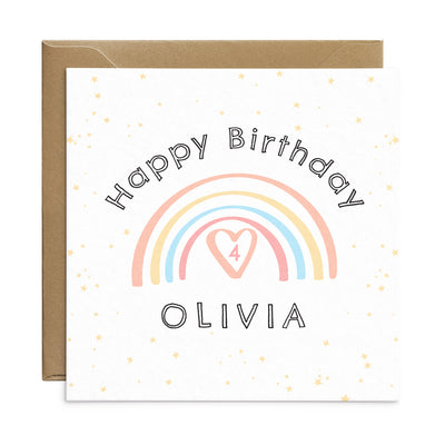 Personalised rainbow birthday card for children. A square card with pale stars in the back ground and a pastel pink rainbow. The rainbow has the number 4 below  and the text can be personalised - text reads Happy Birthday Olivia. Birthday card by Poppins and co.